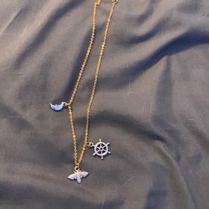 Necklace with moth, moon, ship wheel charms